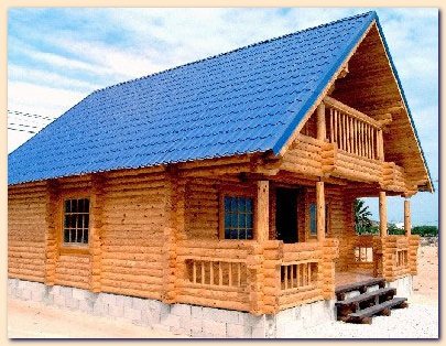 Glued balks for wall of wooden house, regularized round timber. Wood frame houses